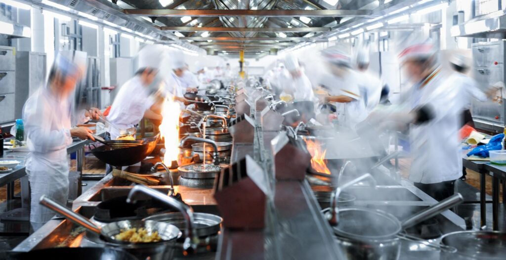 High-volume restaurant kitchen operations during service illustrating execution challenges and foodservice efficiency at scale