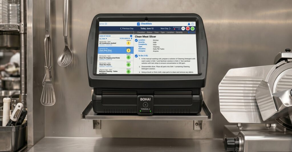 BOHA! T2 mounted in a commercial kitchen showing a BOHA! Checklist screen for back-of-house workflow access.