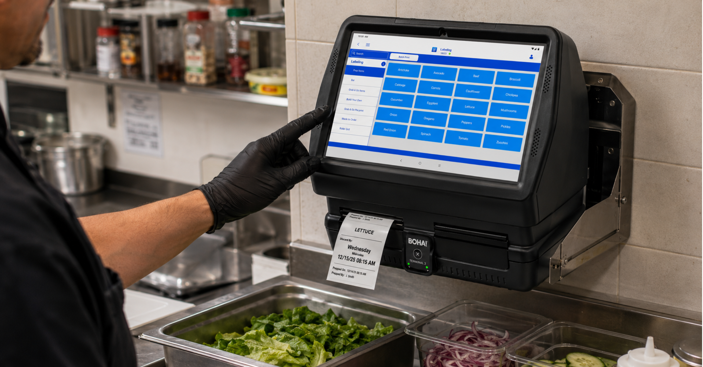 BOHA! Terminal 2 fixed labeling station in a back-of-house kitchen BOHA! Terminal 2 mounted above a commercial prep station printing a lettuce prep label in a back-of-house kitchen.